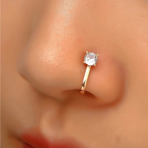 Close-up of a gold S925 sterling silver nose cuff with a sparkling round zircon stone