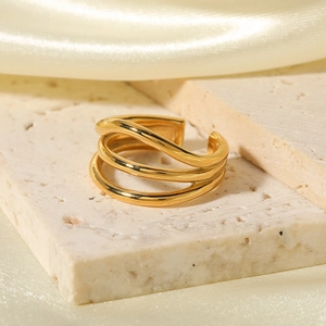 18K gold-plated multilayer open ring with a glossy finish on natural stone background