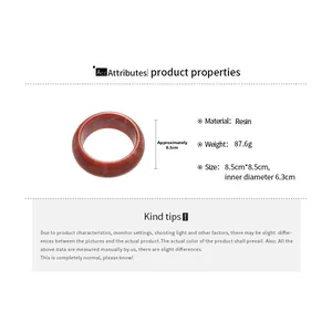 Detail view of red resin bangle showing marble texture and 8.5cm outer diameter