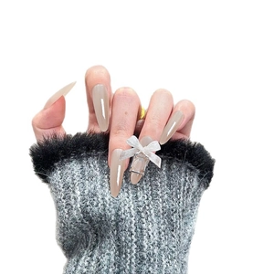 Almond-shaped cat-eye press-on nails with jelly grey finish and silver glitter bow