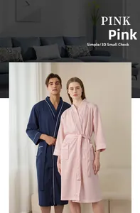 Detail showing dusty pink waffle weave fabric texture and contrasting piping on the robe