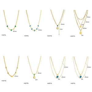 Collection of eight gold-plated necklaces with heart, butterfly and coin pendants