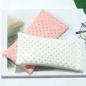Quilted PU leather sunglasses pouches in pink and white with sequin diamond patterns