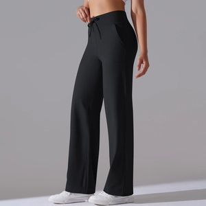 Detail of high waisted black wide leg yoga pants showing drawstring and side pockets
