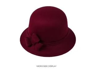 Detail view of burgundy wool felt basin hat with elegant side bow decoration