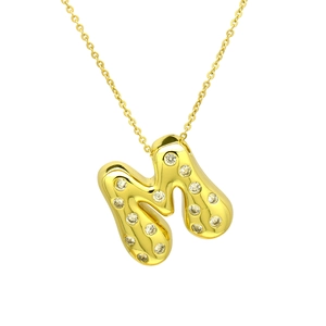 Detail of gold-plated puffy letter M pendant necklace with sparkling cubic zirconia inlay