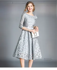 Detailed view of elegant light blue floral lace embroidery on a mid-length dress sleeve