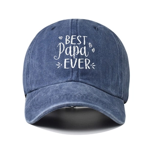 Macro shot of BEST PAPA EVER embroidery on washed navy blue cotton baseball cap