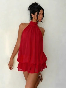 Detailed view of layered ruffle hem on red halter chiffon mini dress for vacation