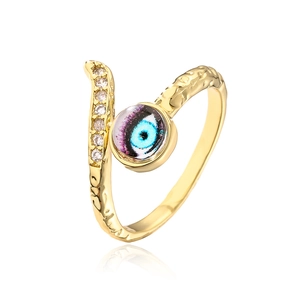 Macro shot of 18K gold plated evil eye ring featuring sparkling cubic zirconia stones