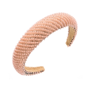 Detail of pink pearl headband with diagonal rhinestones and soft velvet lining