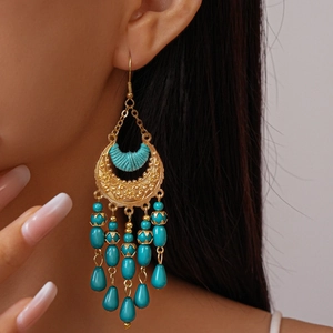 Vintage bohemian crescent tassel earrings with turquoise beads and gold floral carving