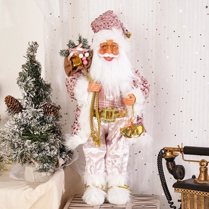 Standing Santa Claus doll in pink sequined coat with gift bag and golden bells ornament