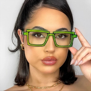 Macro detail of 2D cartoon style TR90 glasses frame with bold black outlines in green