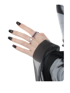 Close-up of S925 silver serpent ring and beaded pink gemstone ring on model