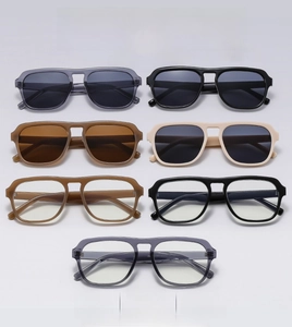 Flat lay of retro oversized square aviator sunglasses in multiple stylish colors
