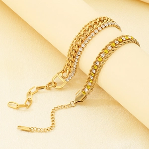 Detailed macro view of gold-plated stainless steel Cuban chains with zircon inlays