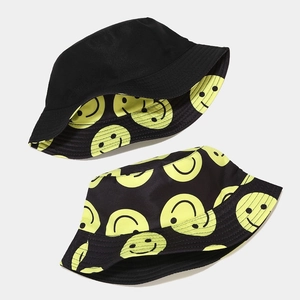 Double-sided black and yellow smiley face bucket hat with cute embroidered pattern