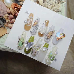 Detail of 3D embossed green butterfly and white rose butterfly nail art stickers