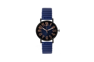 Detailed close-up of dark blue ceramic strap and rose gold numerals on quartz watch