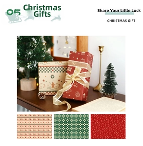 Detail of vintage kraft Christmas wrapping paper with reindeer and festive gingerbread patterns