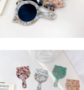 Detailed back view of cat-eared acetate hand mirrors with colorful marble patterns