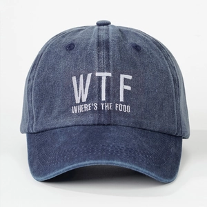 Close-up of blue washed denim baseball cap with WTF WHERE'S THE FOOD white embroidery