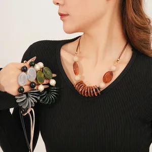 Retro bohemian leather cord necklace with oval resin pendants in brown and green