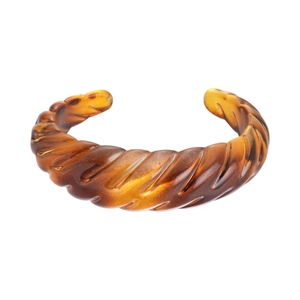 Amber acrylic open cuff bracelet with irregular geometric ribbing and tortoise pattern