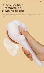 Détail du mécanisme de nettoyage sur le peigne de massage pour chat en forme de patte