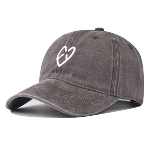 Washed dark gray baseball cap with white heart embroidery in a vintage six-panel design