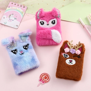 Detailed view of plush animal notebooks featuring cute fox, rabbit and reindeer embroidery