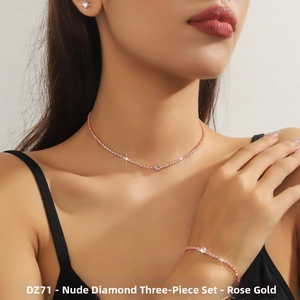 Close-up of rose gold jewelry set with round cubic zirconia on a female model
