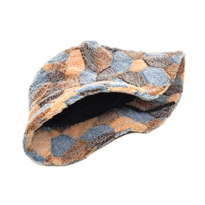Colorful plush patchwork bucket hat in soft faux shearling with adjustable inner strap