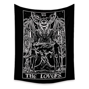 Macro shot of The Lovers tarot card tapestry with Gothic skull and monochrome art detail