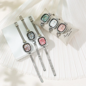 Women's quartz watch with oval zircon case and steel mesh strap in five dial colors