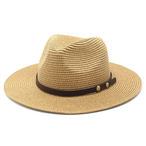 Straw Panama hat with brown leather band and copper buckles for sun protection
