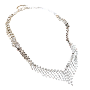 Elegant silver V-shaped tassel necklace featuring sparkling rhinestones on a white background
