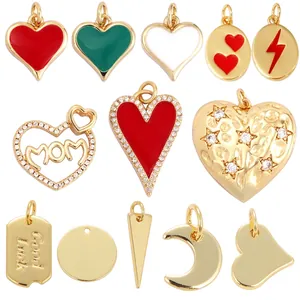 Collection of golden brass charms including hearts and moon shapes for DIY jewelry making