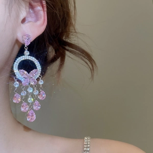 Detail of pink butterfly earrings with sparkling cubic zirconia tassels and crystal drops