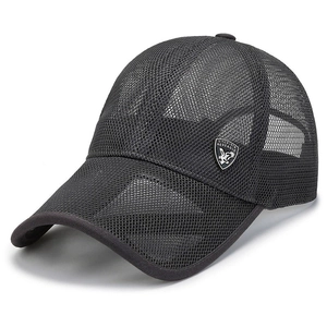Detail view of the shield-shaped eagle emblem on the breathable dark grey mesh sun hat
