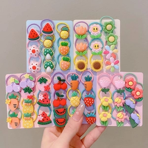 Detailed view of elastic hair bands with colorful resin fruit and flower charms for girls