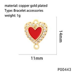 Macro detail of red enamel heart pendant with 18K gold plating and cubic zirconia
