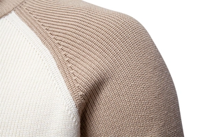 Macro shot of high-density knit texture and raglan sleeve stitching on men's sweater