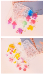 Detail of mushroom, cloud and moon silicone resin molds for DIY earring pendants