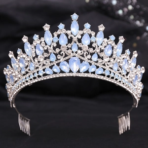 Detailed view of baroque silver crown featuring light blue rhinestones and hair combs