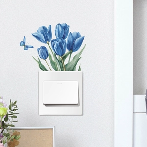 Detail of blue tulip wall decal applied on a light switch against a beige wall decor