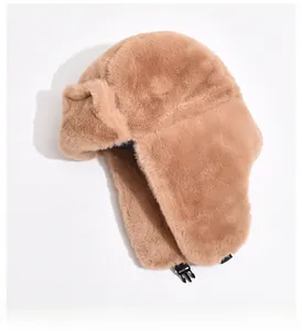 Detail of winter faux fur trapper hat featuring thickened ear flaps and durable buckle