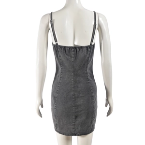 Detail of the elastic shirring and slim straps on a grey washed denim mini dress