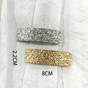 Detailed view of gold and silver rectangle hair clips with 8x2.2cm size measurement